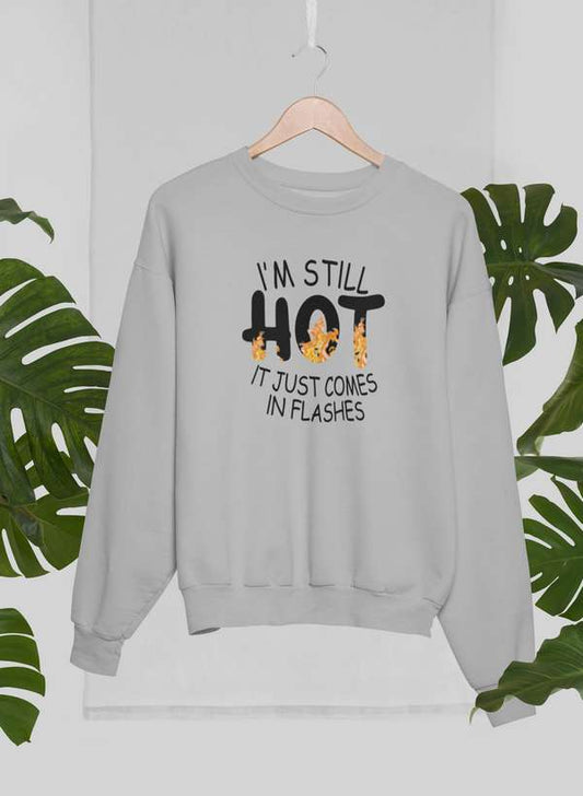 Gray sweatshirt with menopause sweatshirt humor text saying I’m still hot it just comes in flashes