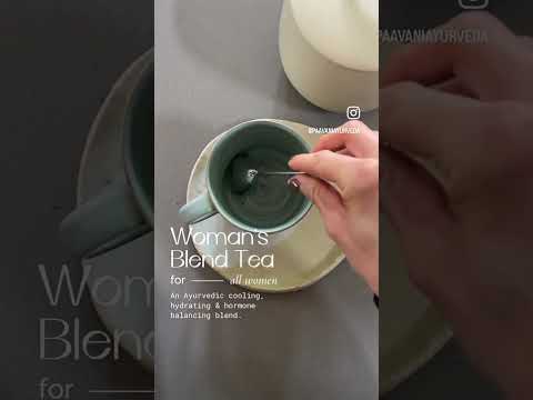Woman stirring ayurvedic tea for hormonal balance in a gray cup on a saucer from DC-PAAVANI Ayurveda