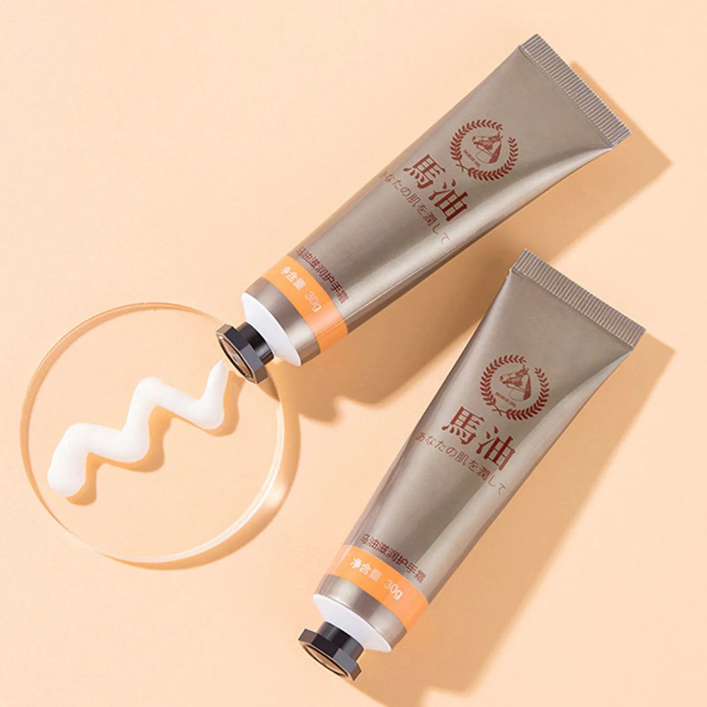 MenoMode repair hand cream for menopause in silver tubes with cream texture on beige background