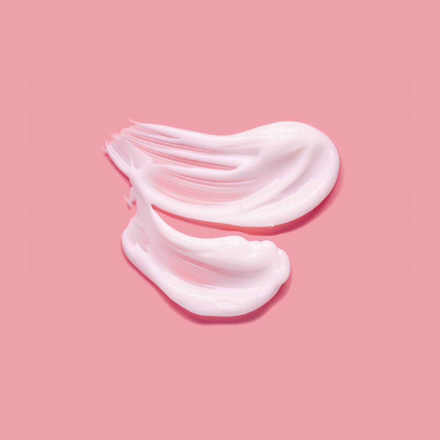 Pink anti-aging serum cream texture by Laila, best skincare for perimenopause on a pink background