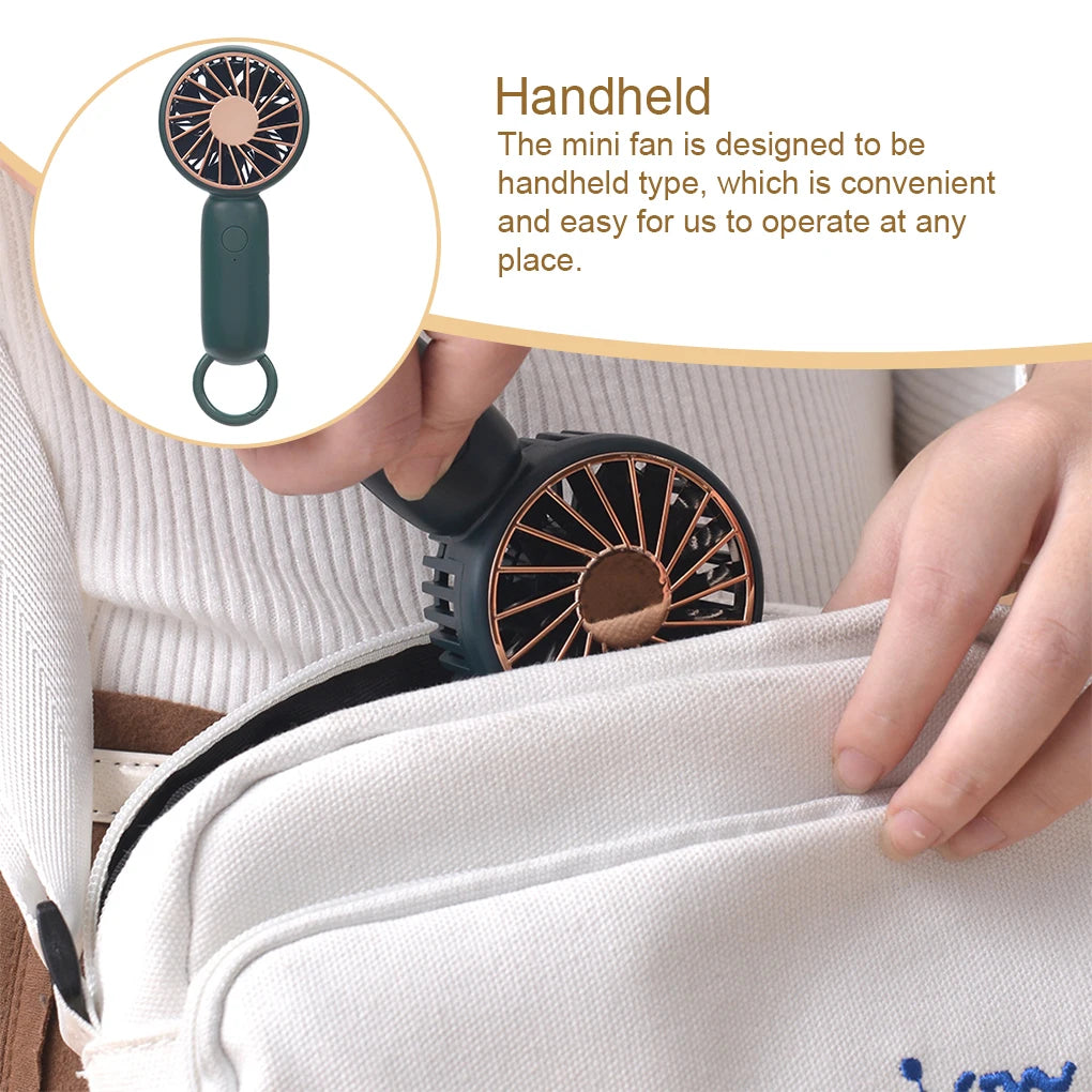 MenoMode rechargeable mini handheld fan with compact design being placed inside a white bag